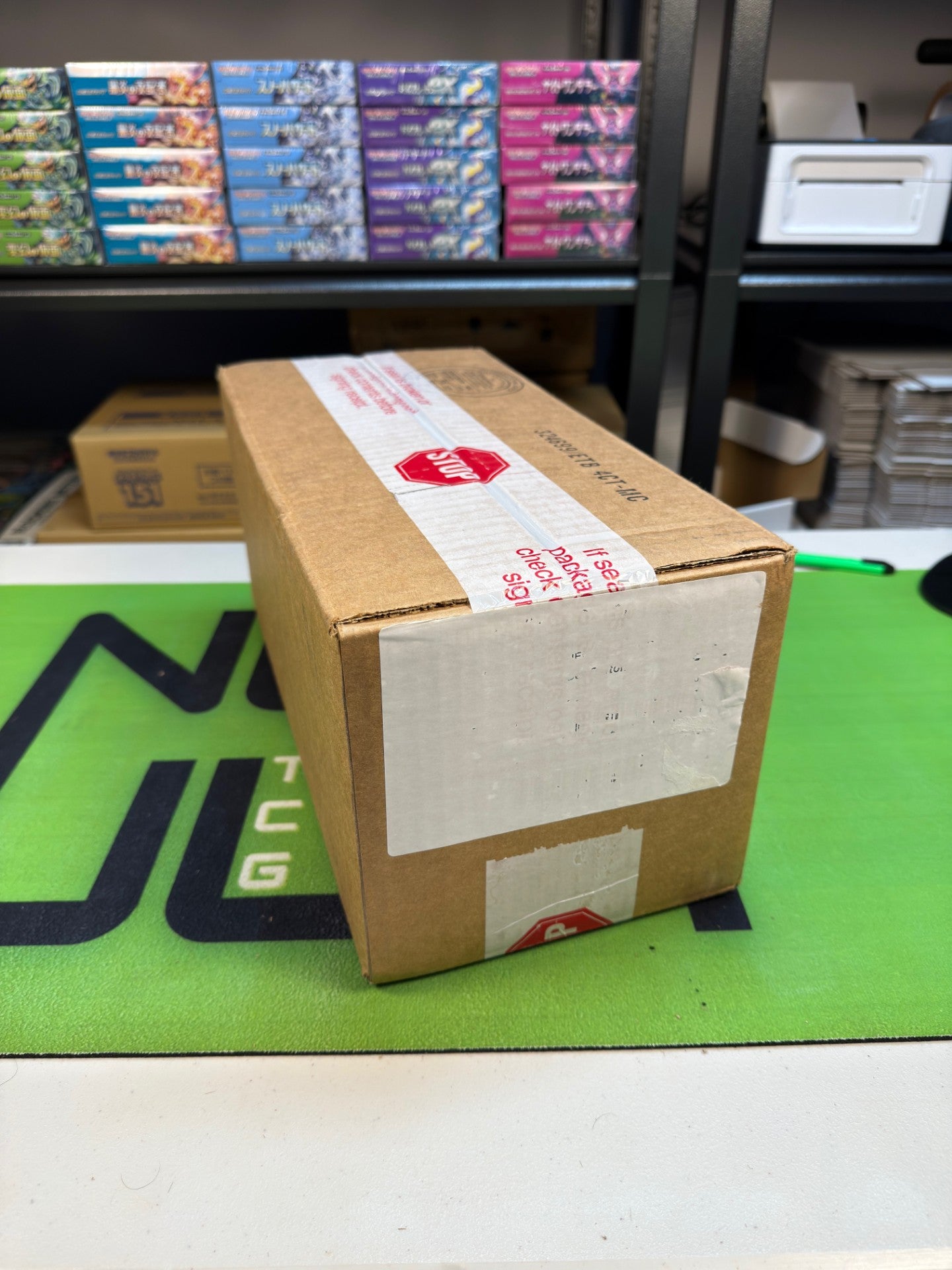 Pokémon Prismatic Evolutions Pokémon Center ETB Case (4 PC ETBs)